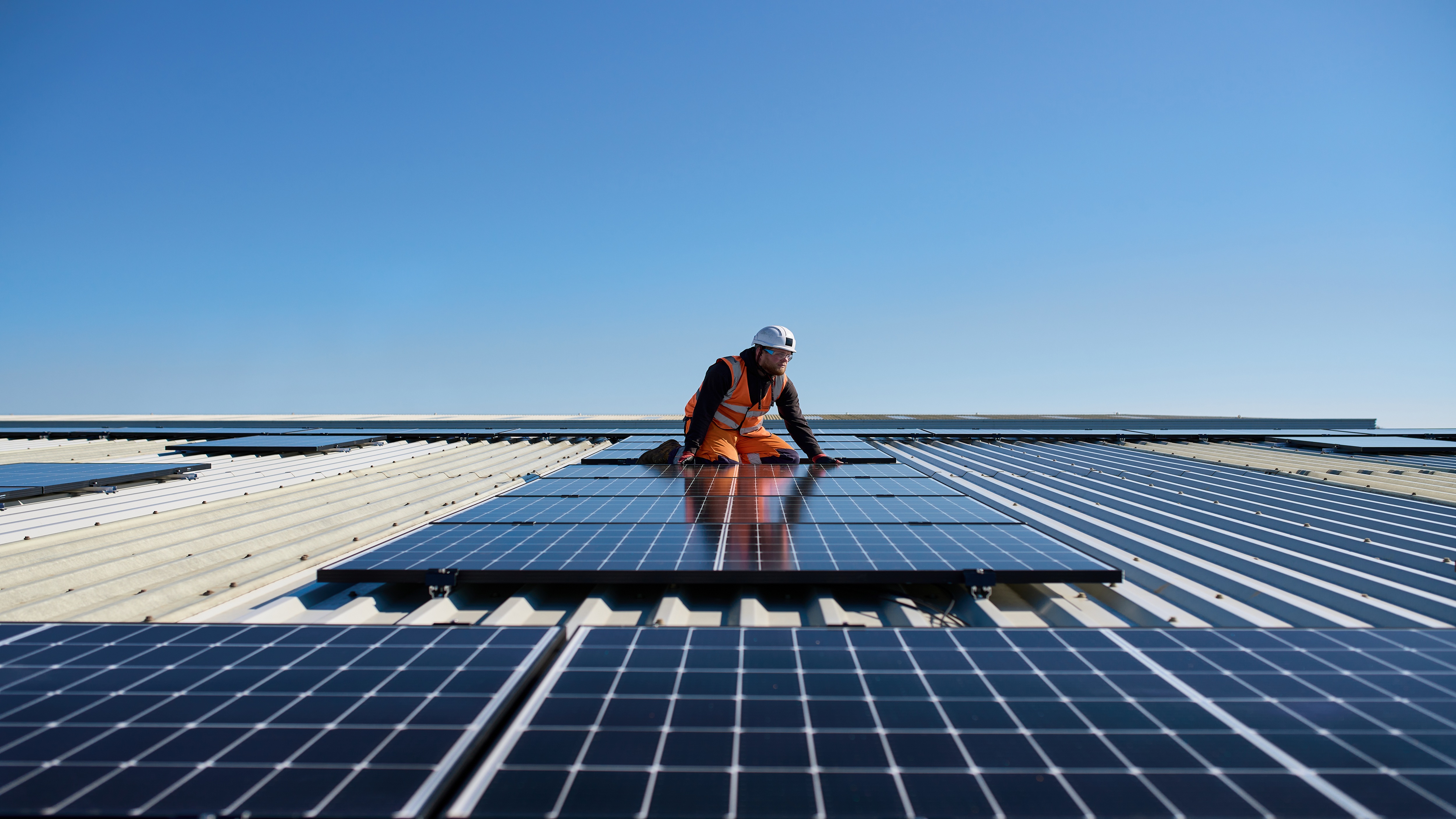Man fitting solar panels at Prologis Park Kettering DC1