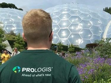 A man looking a geodesic domes wearing a prologis shirt