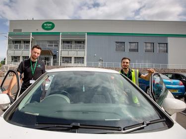 Two men getting into a car Two men getting into a car