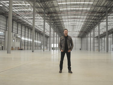 George Clarke in a Prolgis warehouse