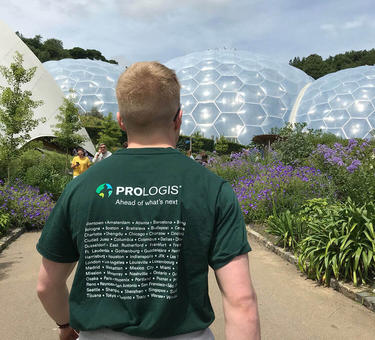 A man looking a geodesic domes wearing a prologis shirt
