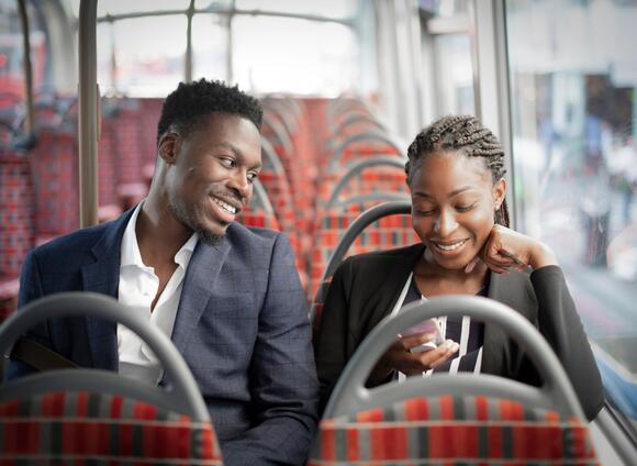 Two people on a public bus