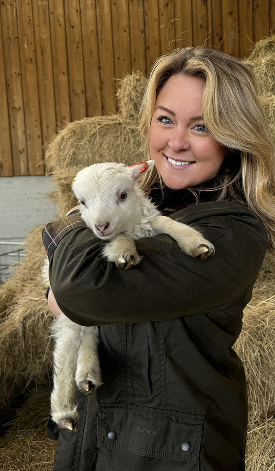 Prologis employee holding a lamb at Lilbourne Meadows, Prologis RFI DIRFT Prologis employee holding a lamb at Lilbourne Meadows, Prologis RFI DIRFT